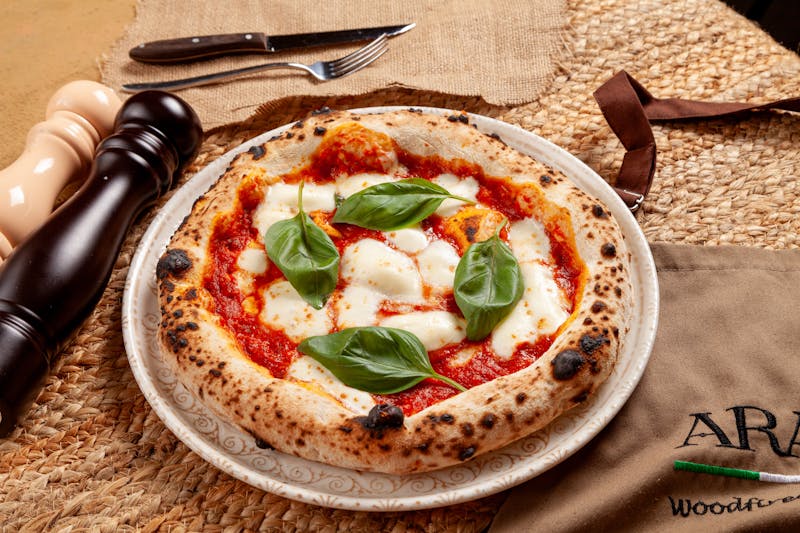 Wood-fired pepperoni luce pizza fresh from the oven